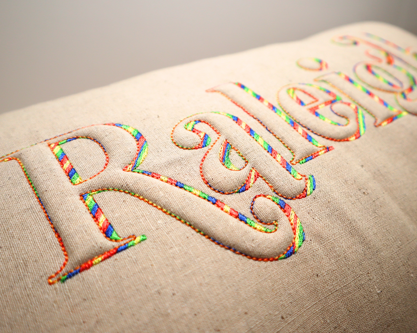 Raleigh Trapunto *RETRO* Lumbar Pillow * Tan Linen with Rainbow thread * North Carolina * 3D lettering