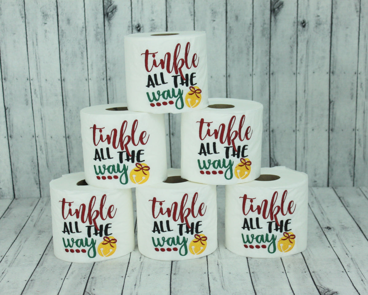 Stack of tinkle all the way embroidered toilet paper rolls