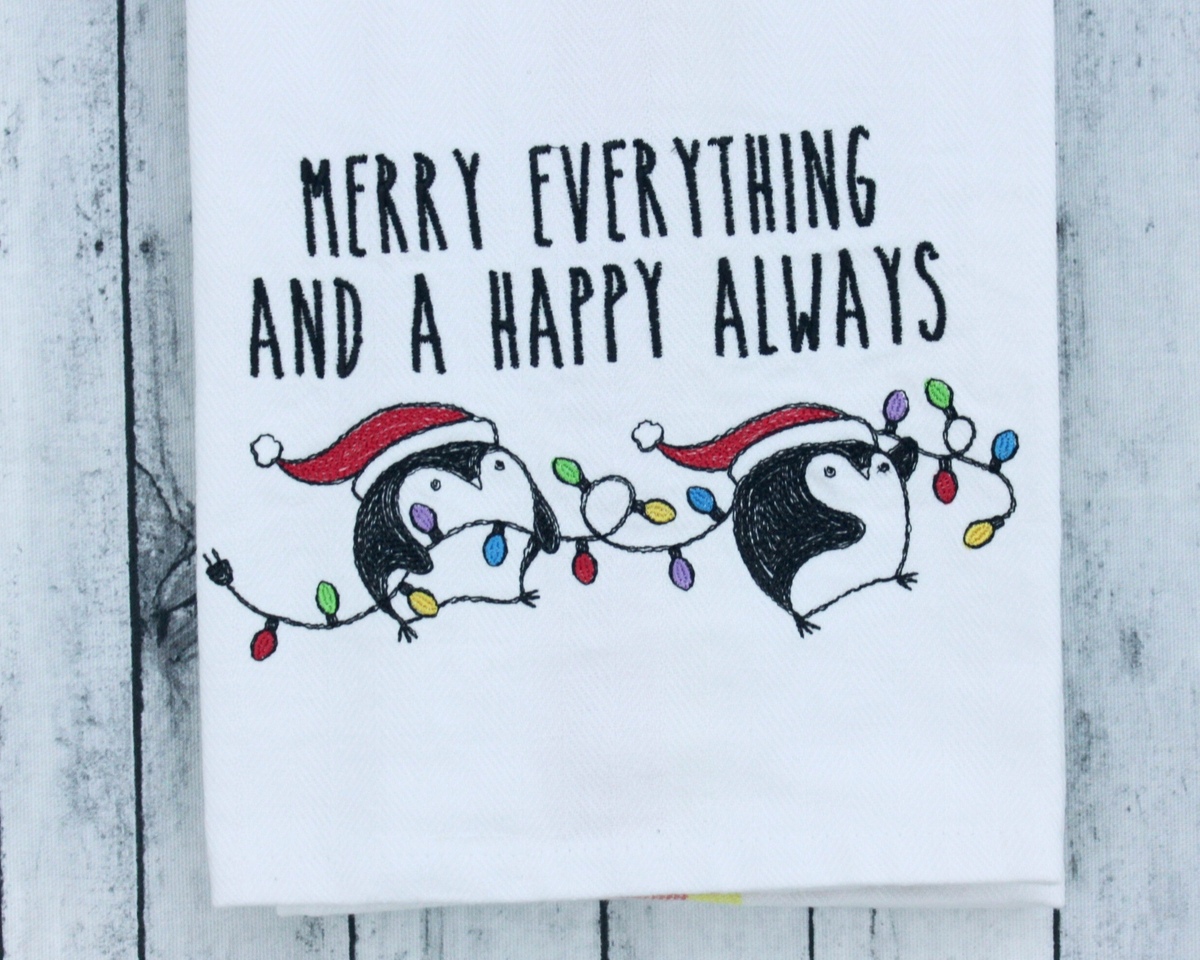 Merry everything penguins embroidered towel, styled photo