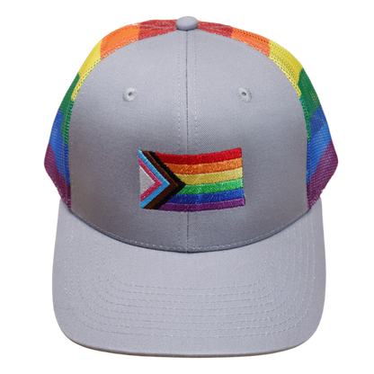 Front view of a gray structured hat with a waving Progress Pride flag embroidered on the center front panel