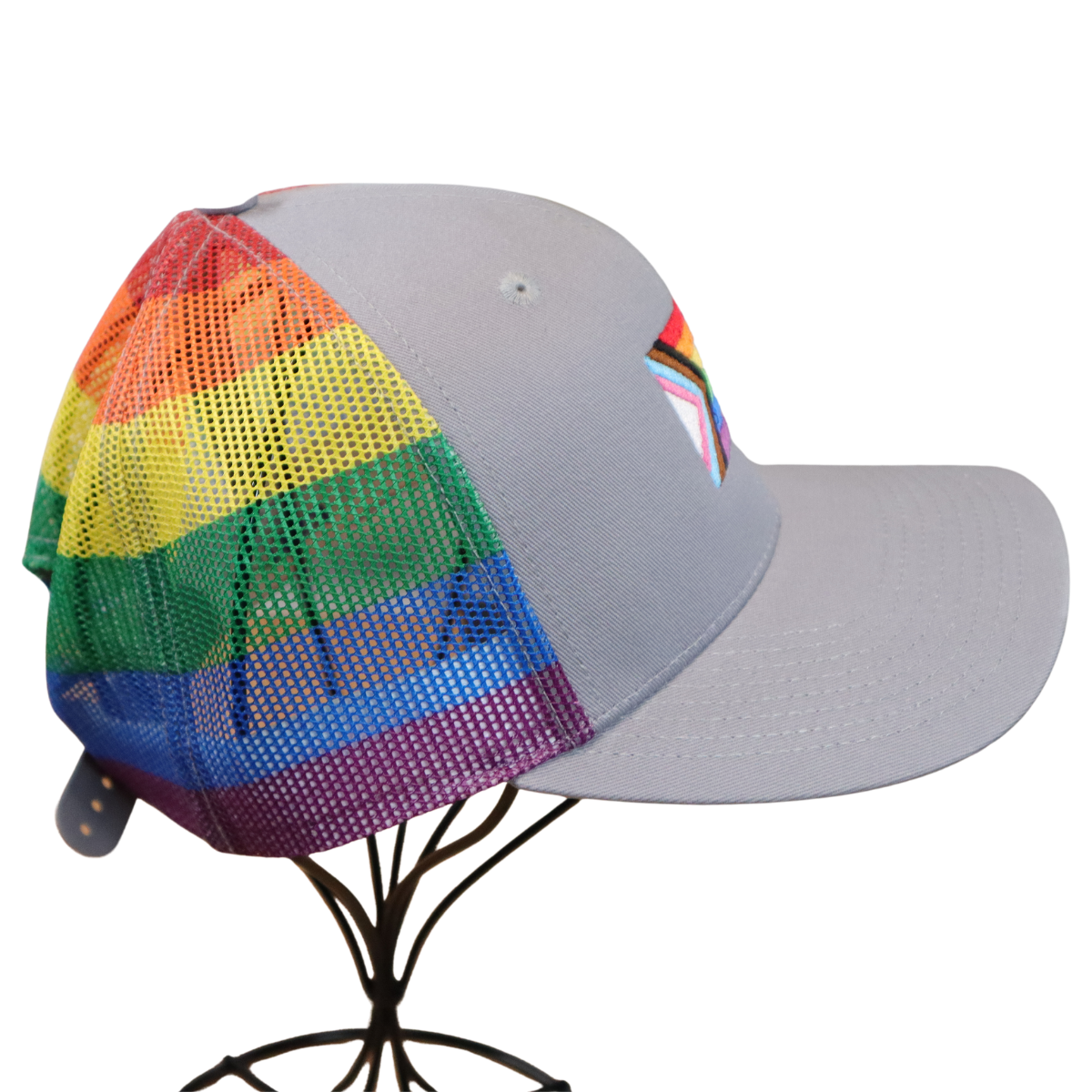 Back of a gray hat with rainbow striped mesh panels, displayed on a wire hat stand